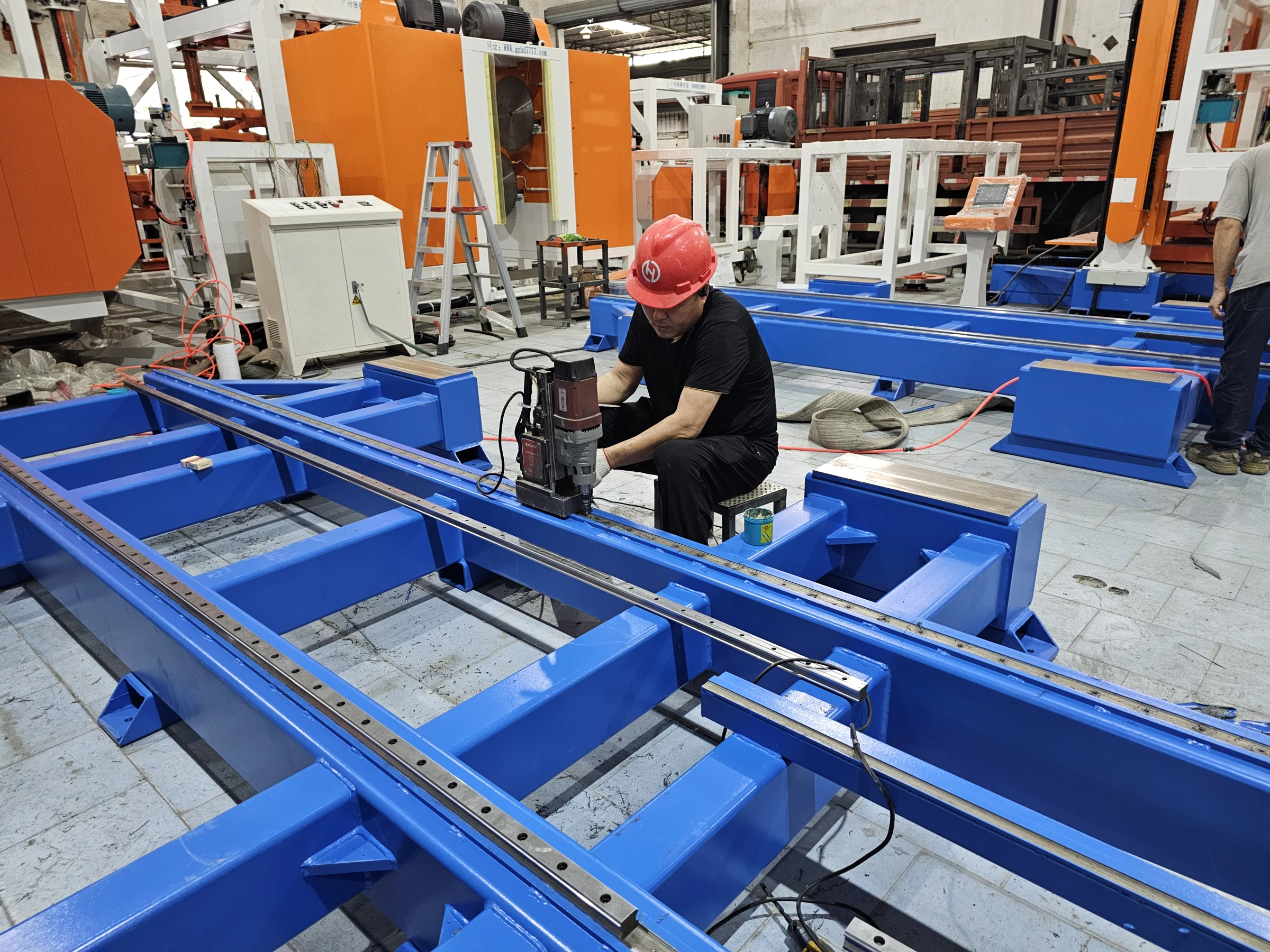 HENGDE technician fabricating an equipment frame inside the workshop