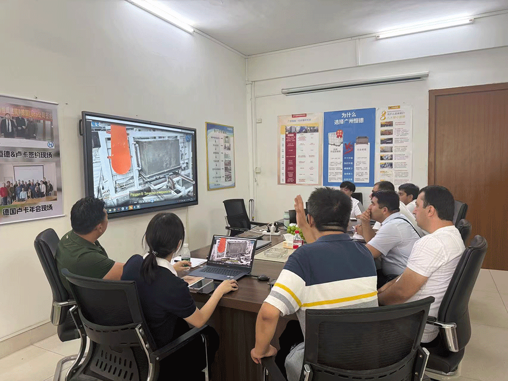 Tajikistan project team reviewing HENGDE lightweight block production equipment — factory visit image 1
