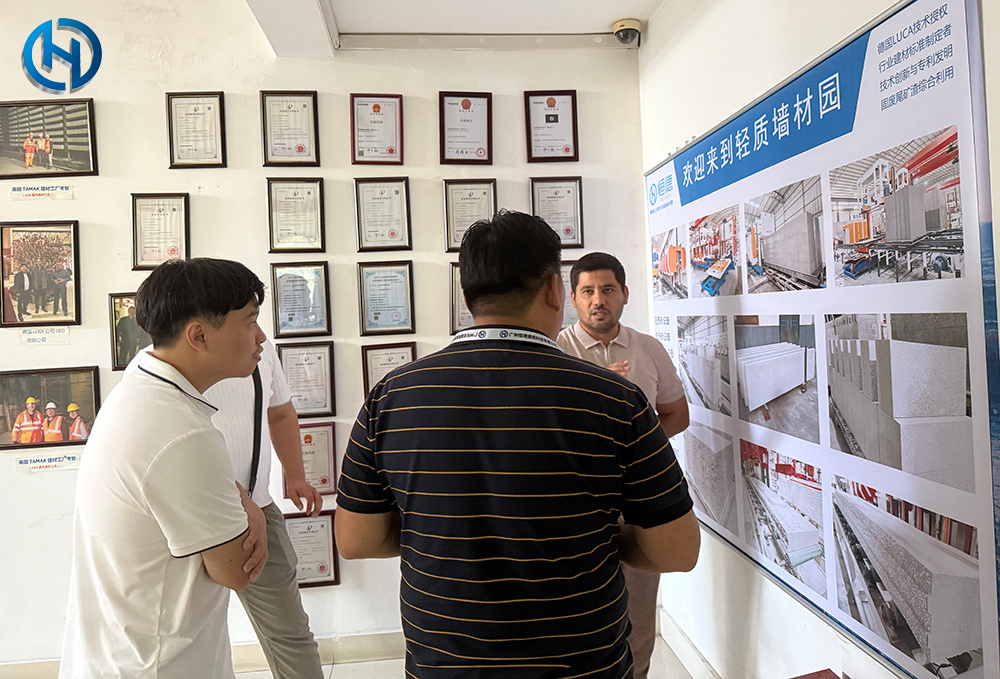 Uzbekistan project team reviewing HENGDE lightweight block production equipment — factory visit image 1