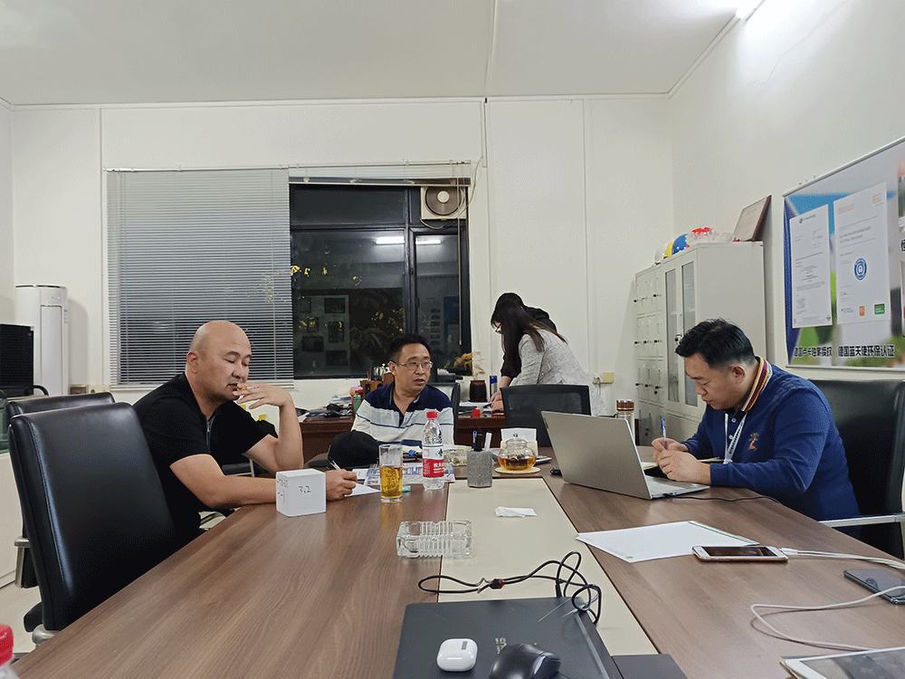 Kazakhstan project team reviewing HENGDE lightweight wall panel production equipment — factory visit image 1