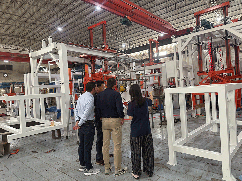 HENGDE project team reviewing HENGDE eps lightweight block production equipment — factory visit image 2