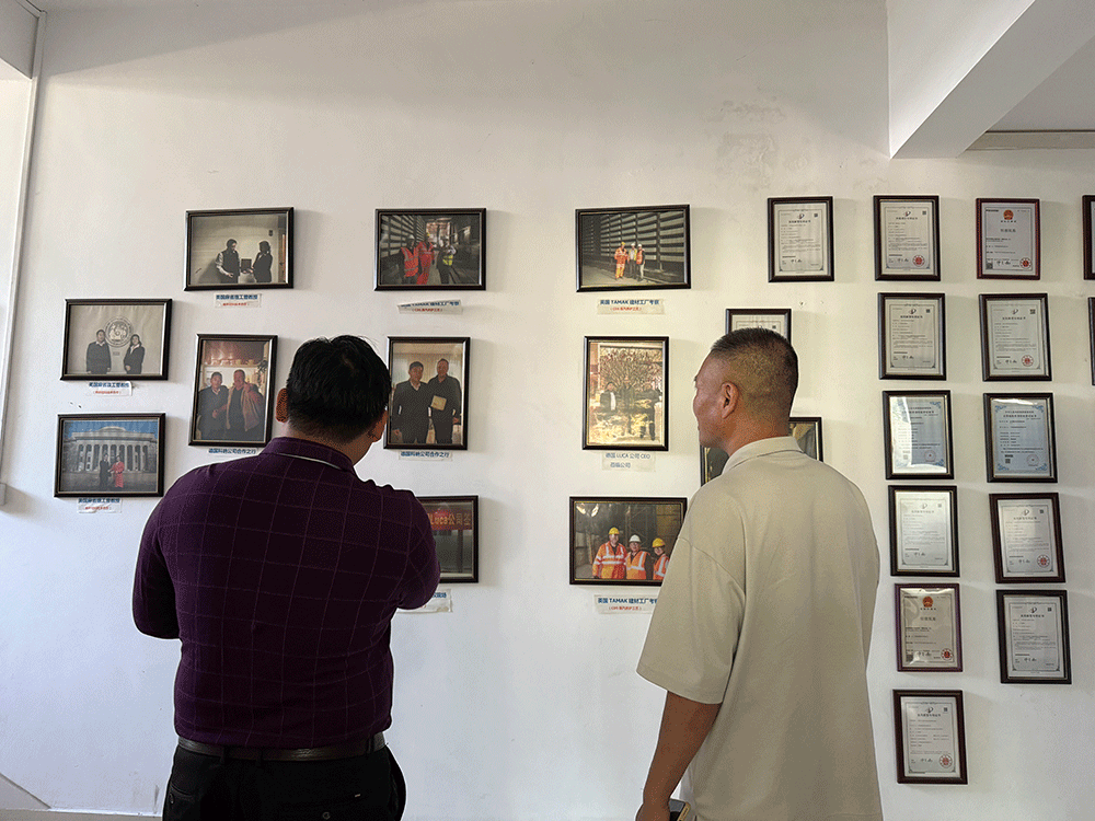 HENGDE project team reviewing HENGDE solid-waste lightweight materials production equipment