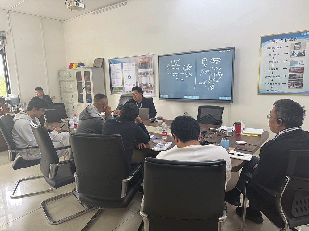 Uzbekistan project team reviewing HENGDE clc / foamed concrete block production equipment — factory visit image 1