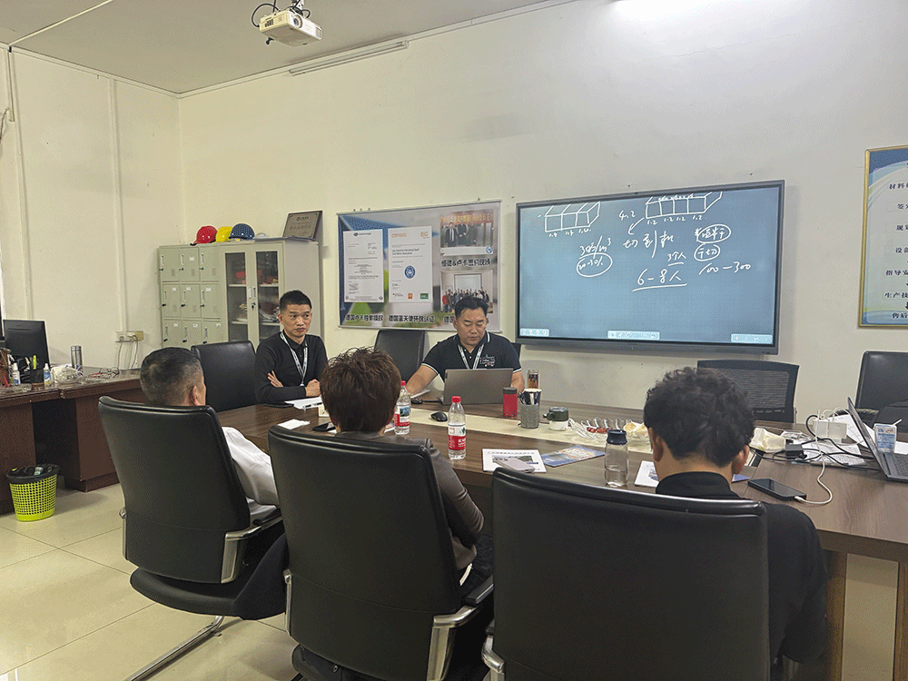 China project team reviewing HENGDE ceramsite lightweight block production equipment — factory visit image 1