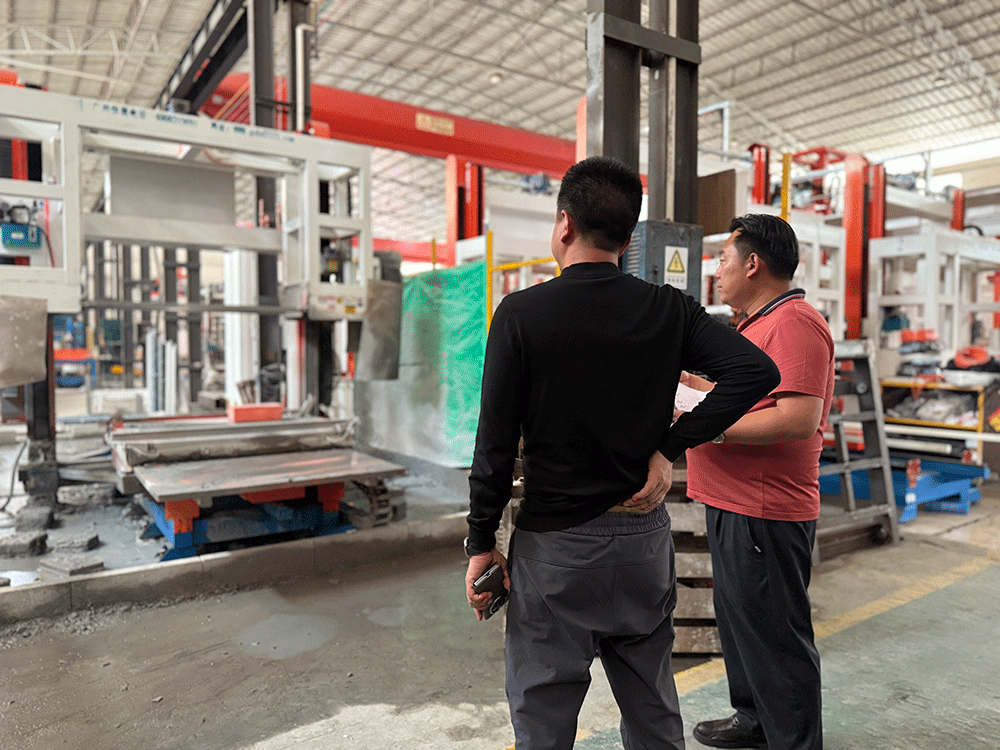China project team reviewing HENGDE clc / foamed concrete block production equipment — factory visit image 1