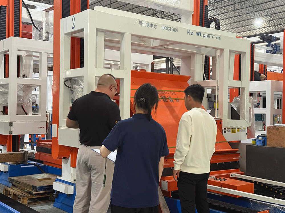 Rwanda project team reviewing HENGDE lightweight wall-material equipment production equipment — factory visit image 1