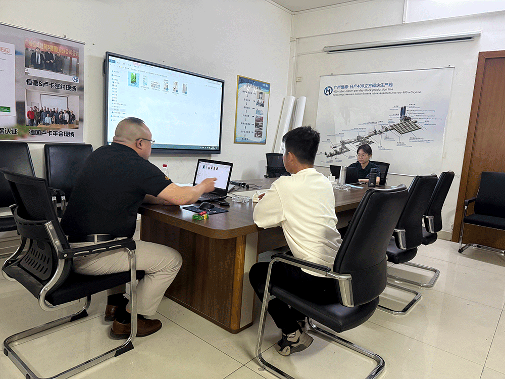Rwanda project team reviewing HENGDE lightweight wall-material equipment production equipment — factory visit image 3