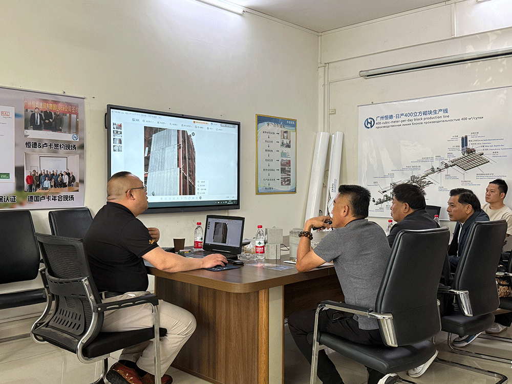 Philippines project team reviewing HENGDE lightweight wall panel production equipment — factory visit image 2
