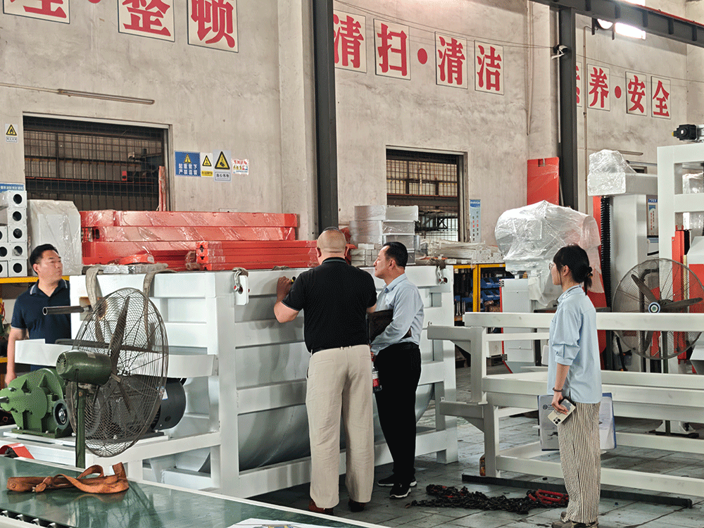 China project team reviewing HENGDE self-insulating block production equipment
