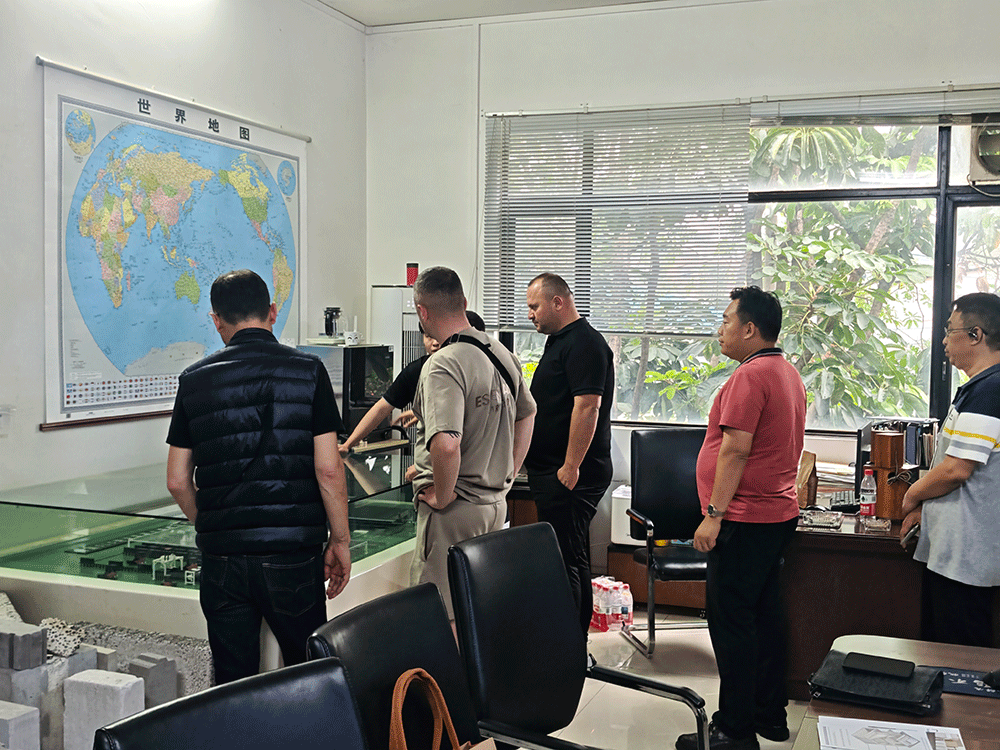 Albania project team reviewing HENGDE cutting system production equipment — factory visit image 1
