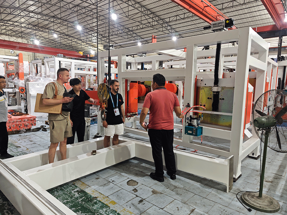Albania project team reviewing HENGDE cutting system production equipment — factory visit image 2