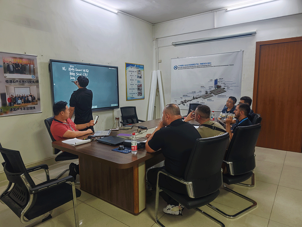 Albania project team reviewing HENGDE cutting system production equipment — factory visit image 4