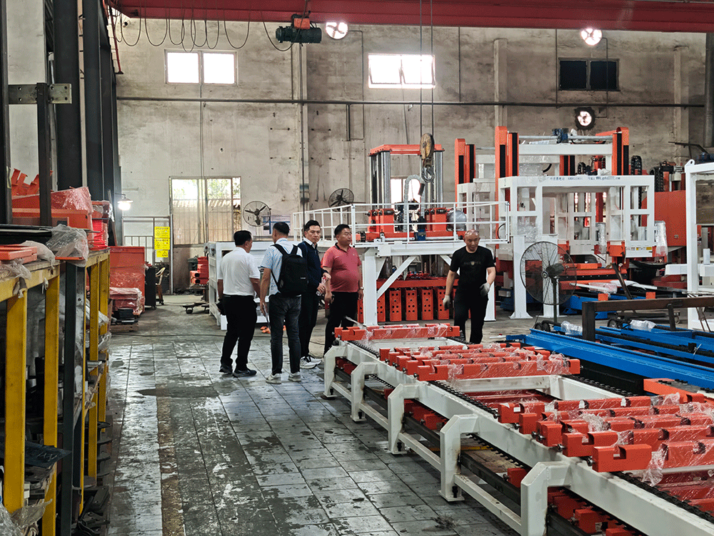 Malaysia project team reviewing HENGDE lightweight block production equipment — factory visit image 2