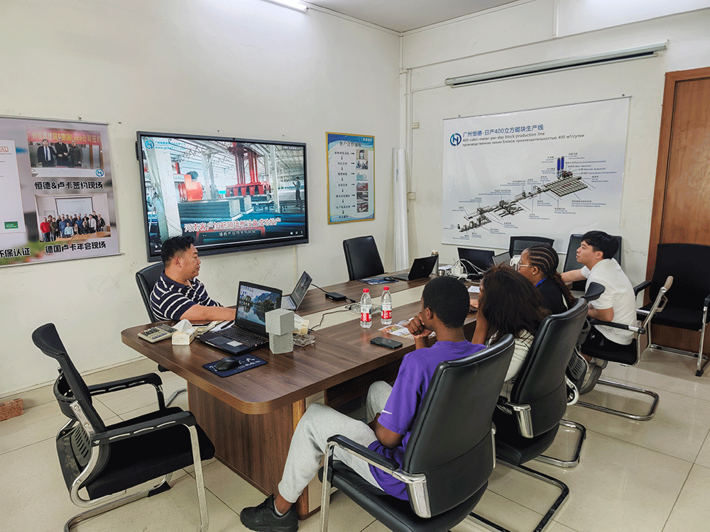 South Africa project team reviewing HENGDE lightweight wall panel production equipment — factory visit image 1