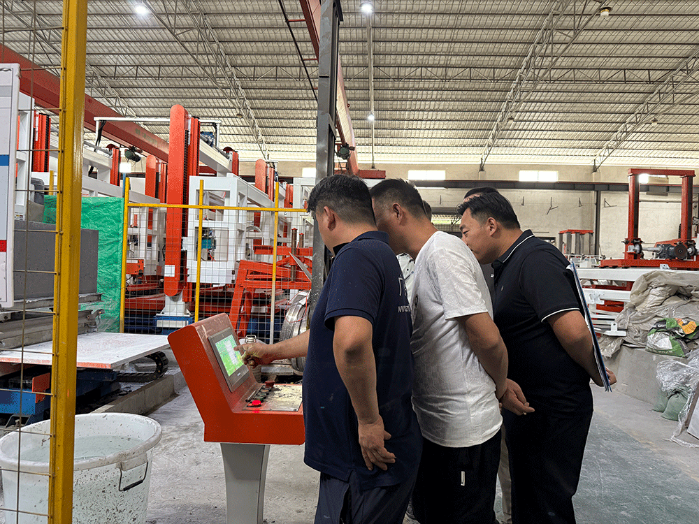 Guyana project team reviewing HENGDE lightweight block production equipment — factory visit image 1