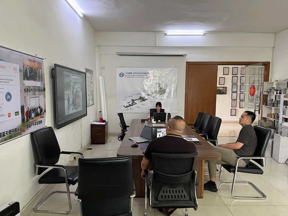 Guyana project team reviewing HENGDE lightweight block production equipment — factory visit image 2
