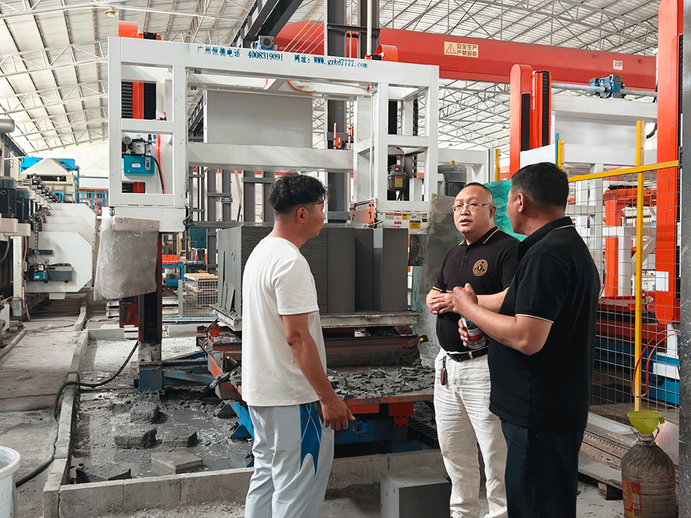 Mongolia project team reviewing HENGDE lightweight block production equipment — factory visit image 2