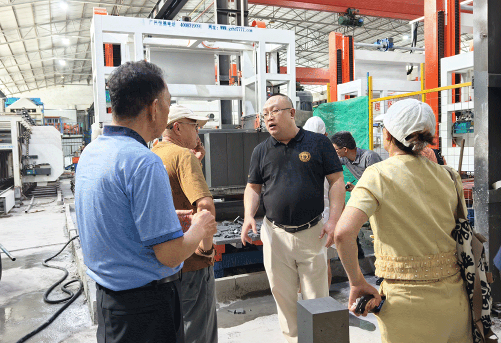 China project team reviewing HENGDE lightweight block production equipment — factory visit image 1