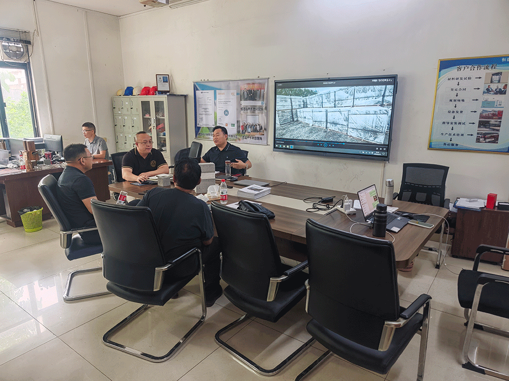 China project team reviewing HENGDE self-insulating block production equipment — factory visit image 1