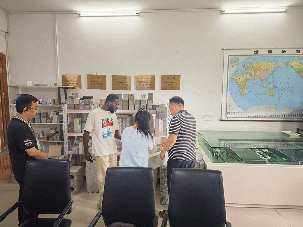Ghana project team reviewing HENGDE lightweight block production equipment — factory visit image 2