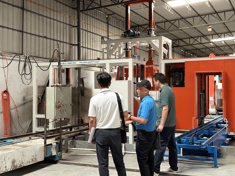 Vietnam project team reviewing HENGDE lightweight block production equipment — factory visit image 1