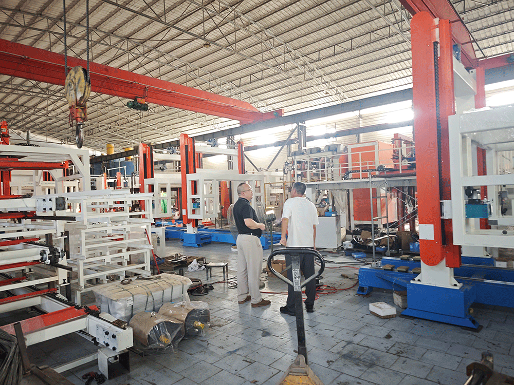 China project team reviewing HENGDE fire-door core panel production equipment