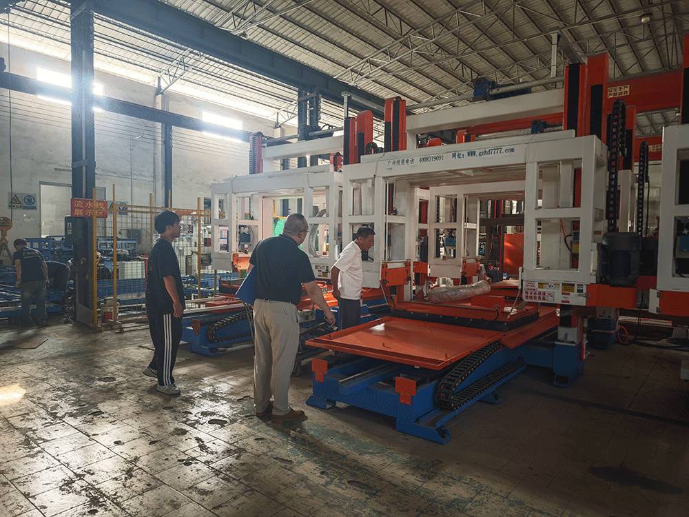 China project team reviewing HENGDE fire-door core panel production equipment — factory visit image 2