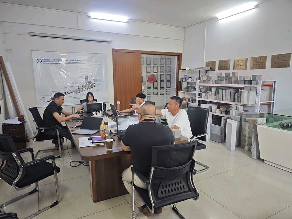 China project team reviewing HENGDE fire-door core panel production equipment — factory visit image 3