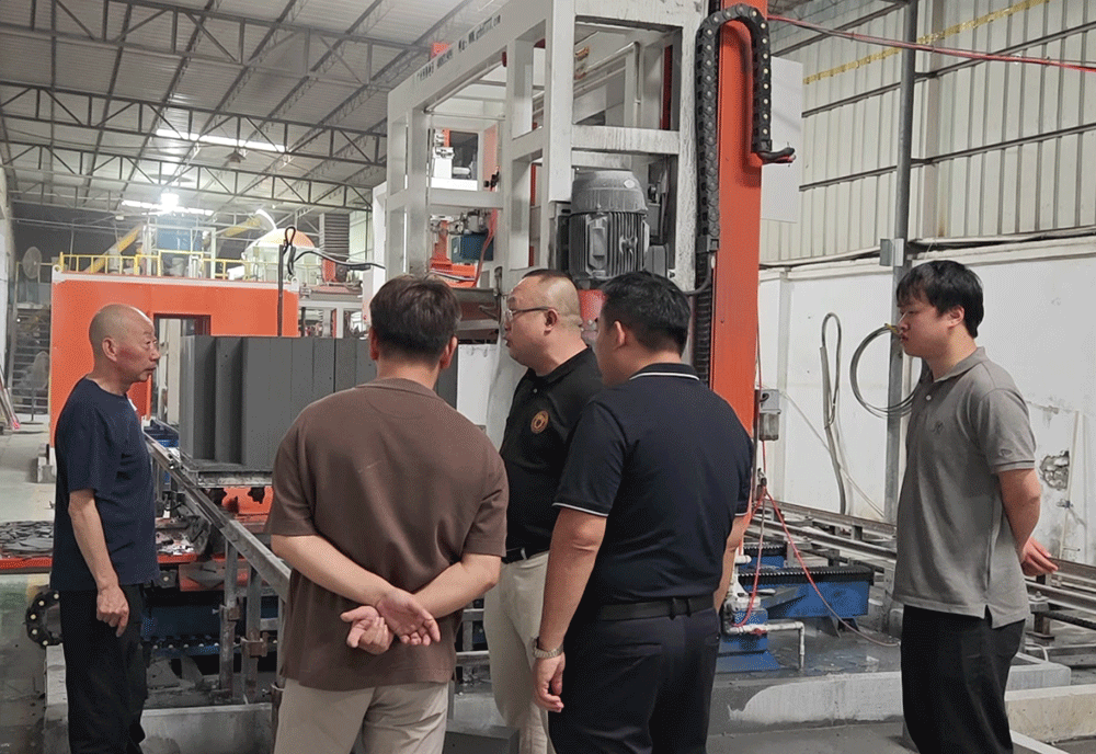 Timor-Leste project team reviewing HENGDE lightweight block production equipment — factory visit image 1