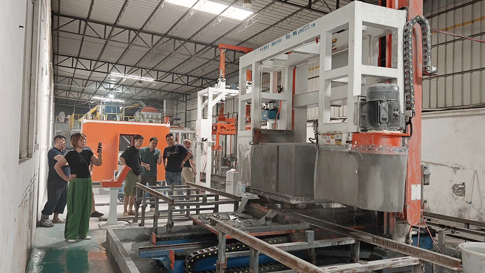 Ghanaian customer reviewing lightweight block cutting equipment in the HENGDE workshop