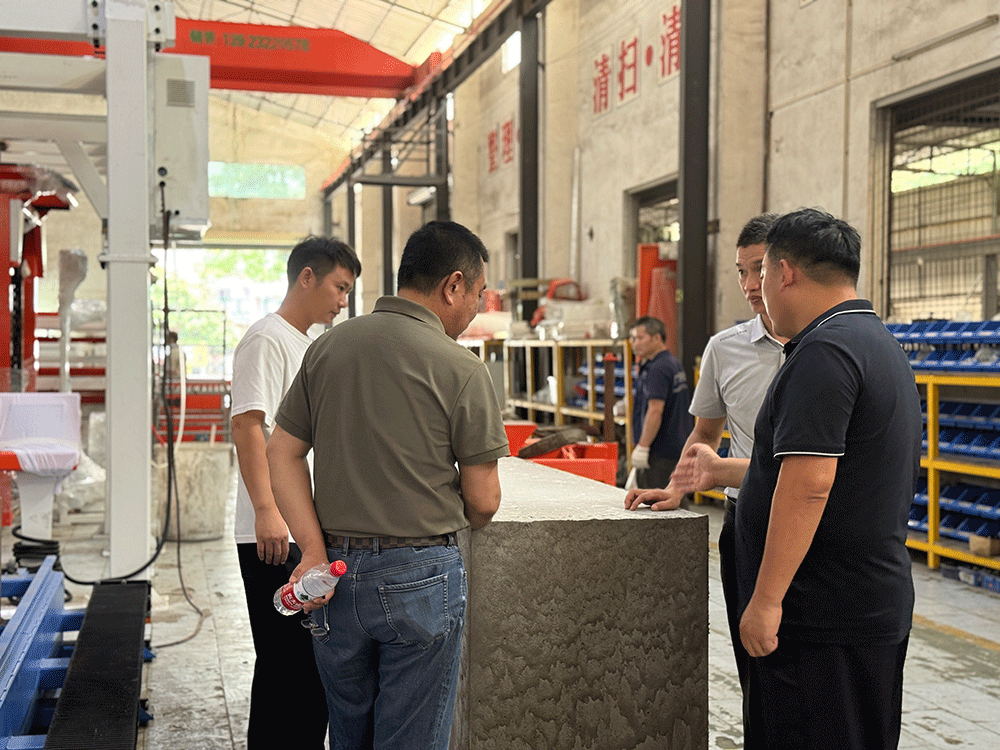 China project team reviewing HENGDE fire-door core panel production equipment — factory visit image 2