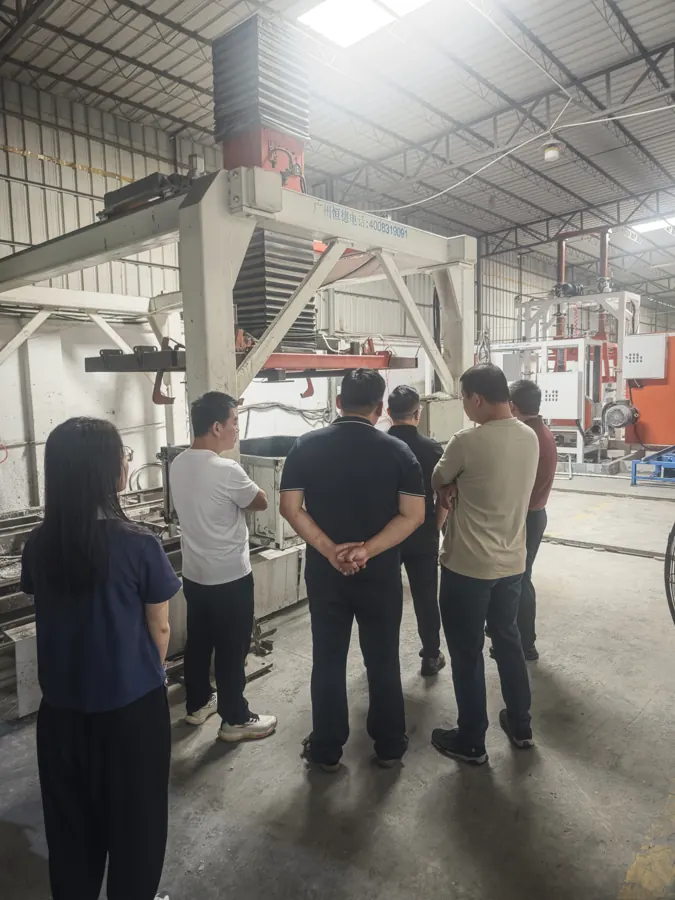 Ethiopia project visitors reviewing equipment in the HENGDE workshop